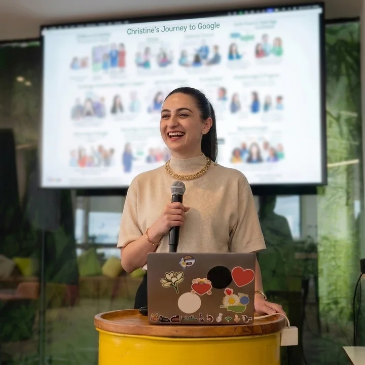 Laughing at the lectern during her talk
