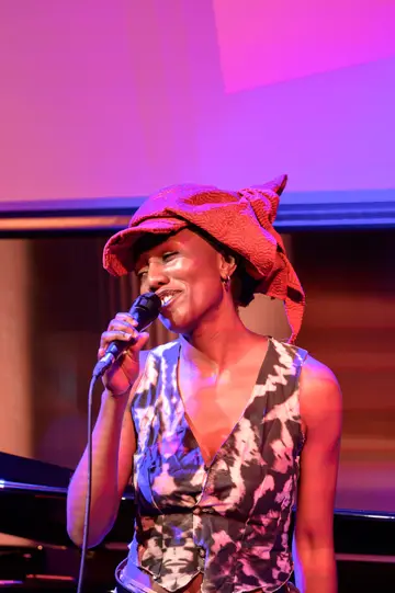Chisara Agor singing, smiling at the room