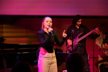 A singer and her guitarist on stage